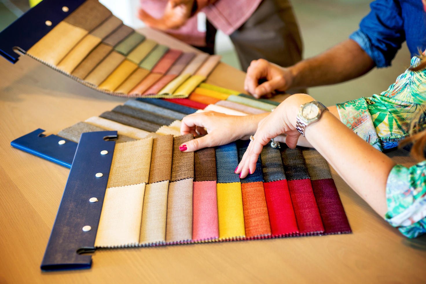 Sales Clerk Showing Fabric Swatches